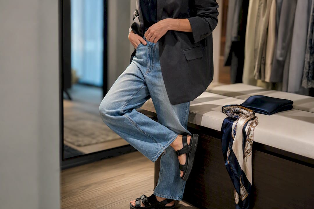 Blazer, scarf, denim, and sandals styled together